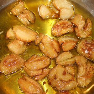 Simmer the garlic on low until a rich golden brown